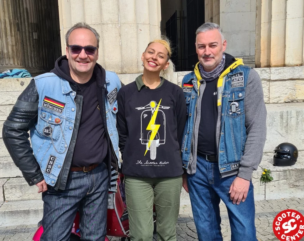 two members of the vespa club munich welcome maryzabel