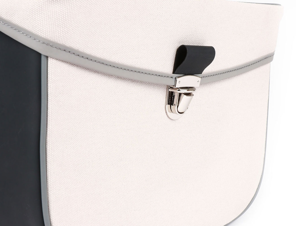 Detail of a white saddle bag for a moped