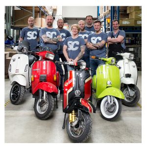 Scooter Center Team in the big warehouse