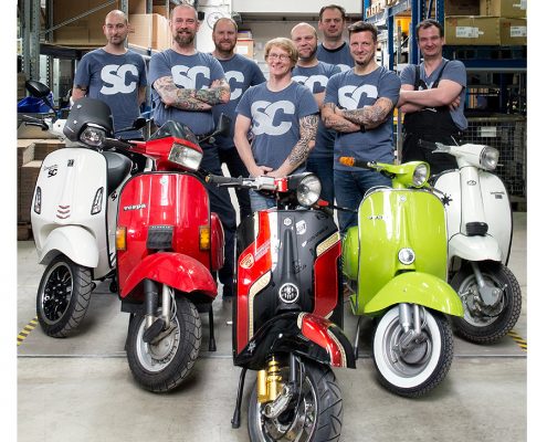 Scooter Center Team in the big warehouse
